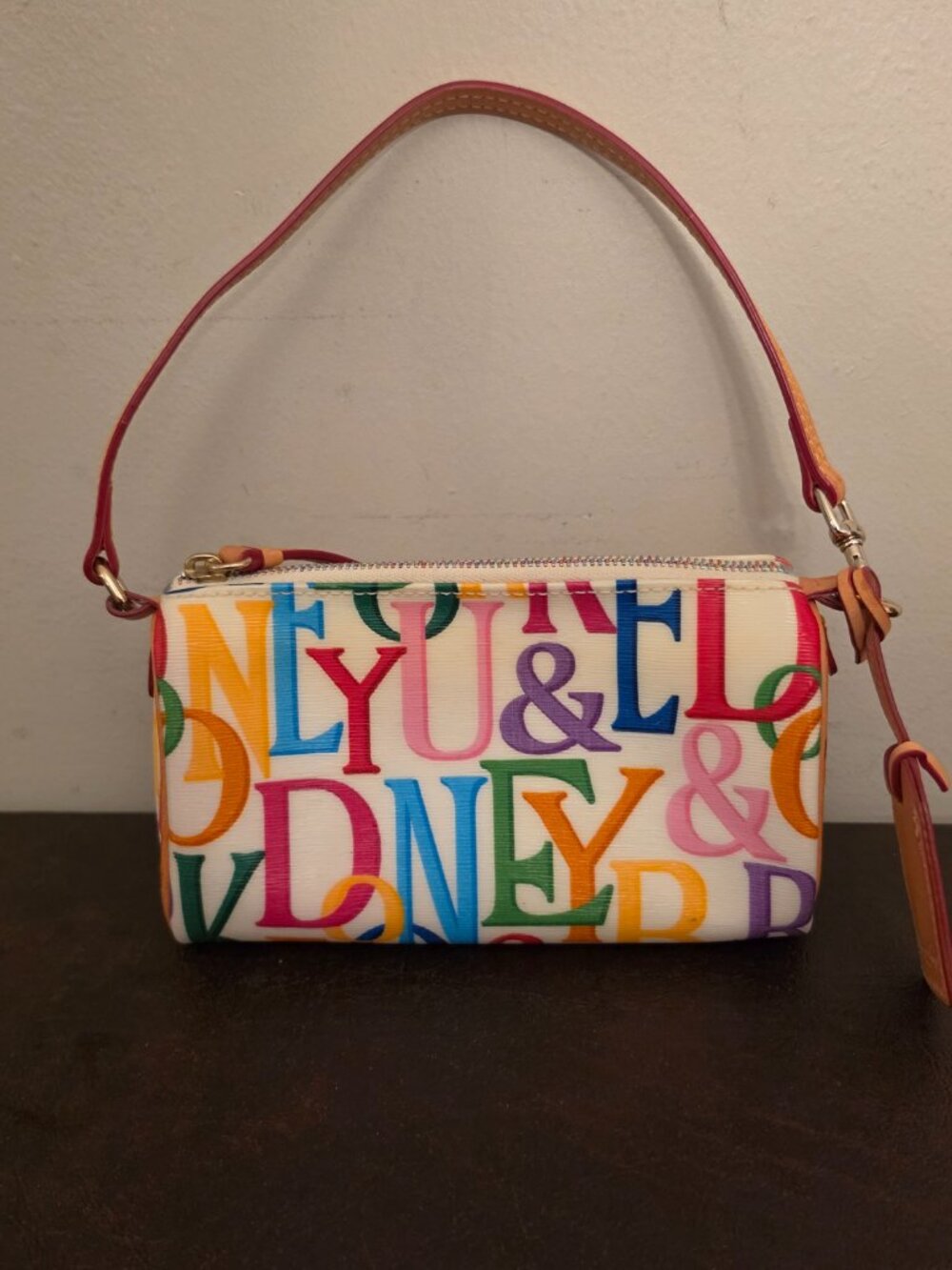 Rare vintage Dooney & Bourke top handle bag colorful and bold black-letter/print